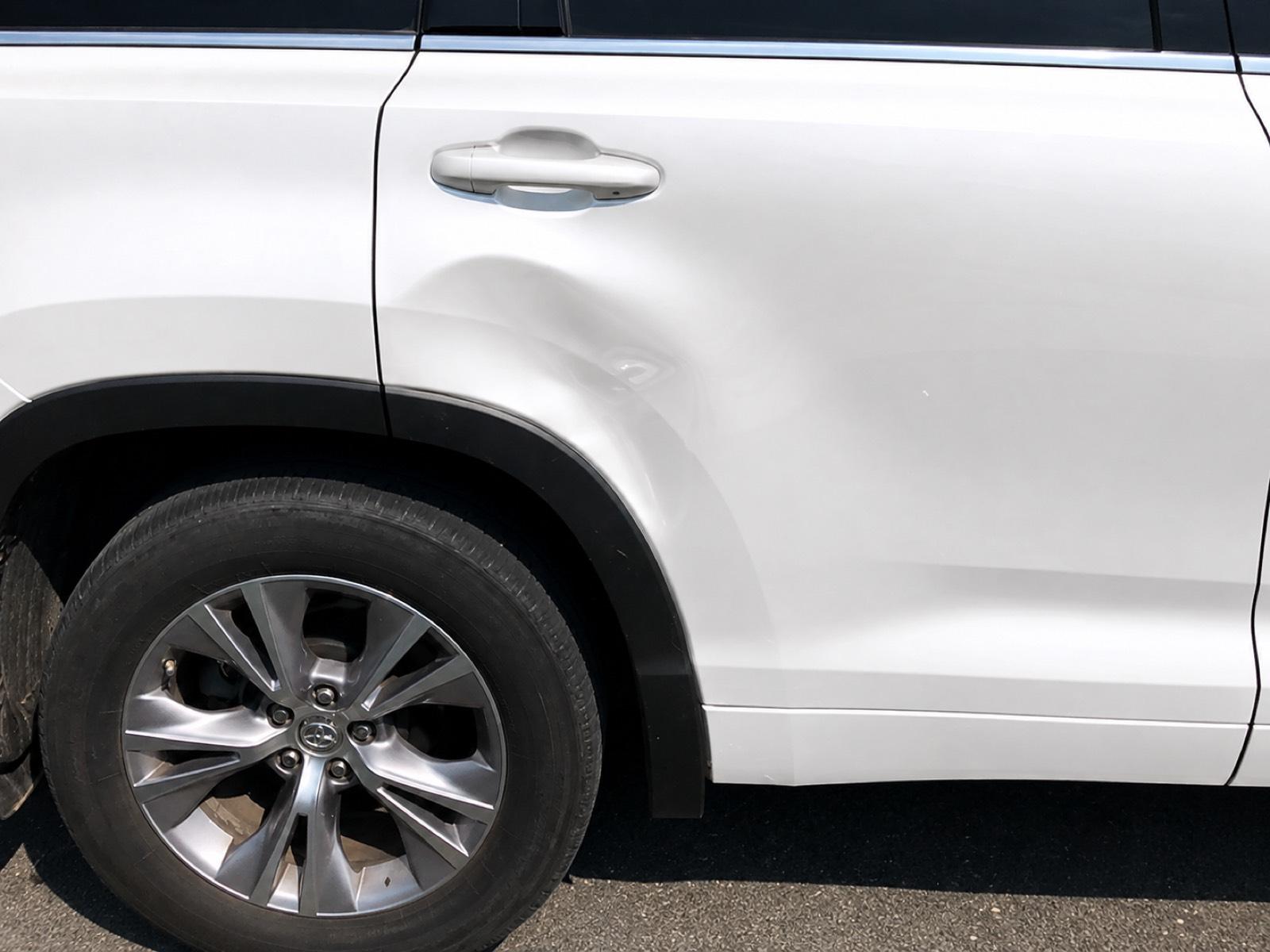 Rear door crease dent — before